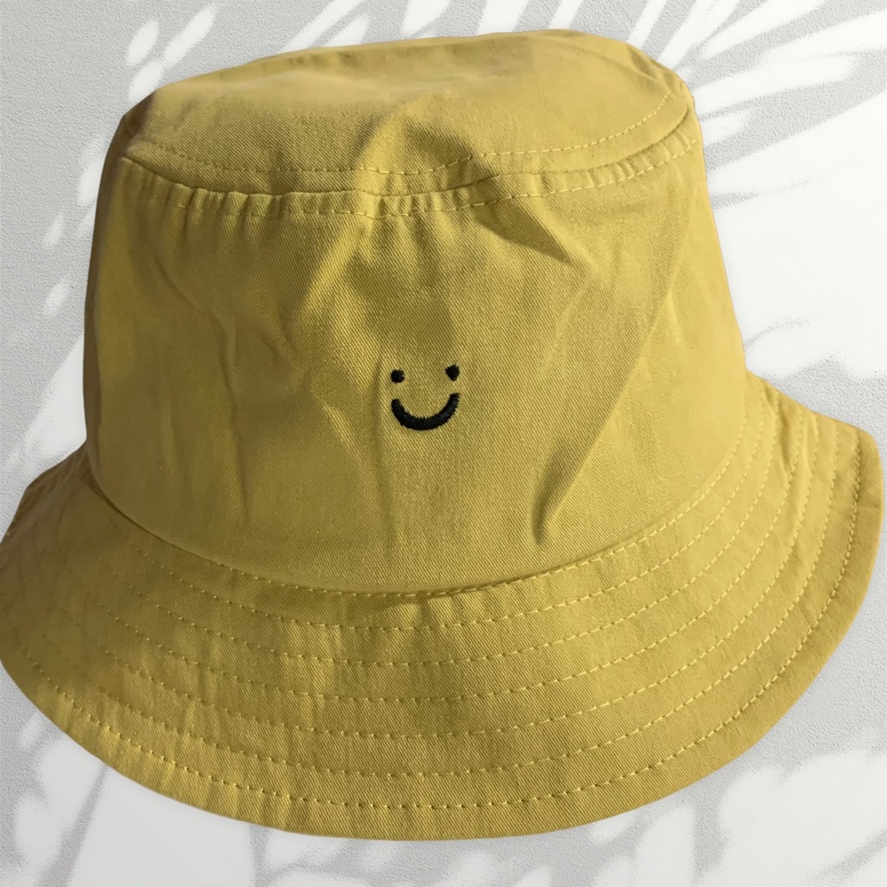 Smiley brown bucket hat
